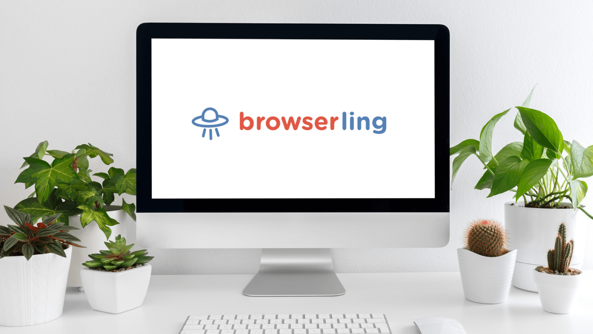 Computer monitor on a desk displaying a logo with text \