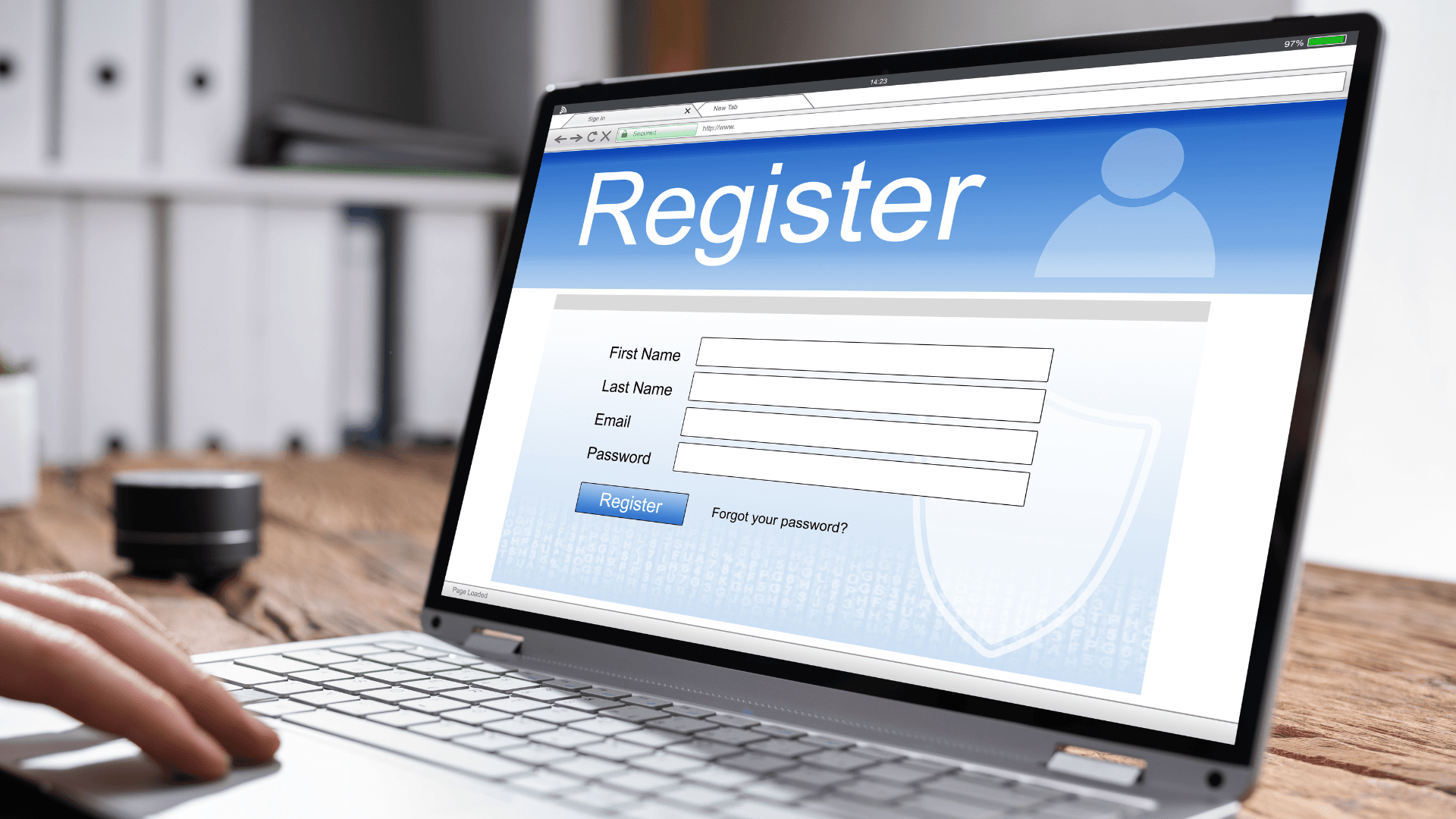 Laptop screen displaying a registration form on a virtual online browser with fields for personal details.