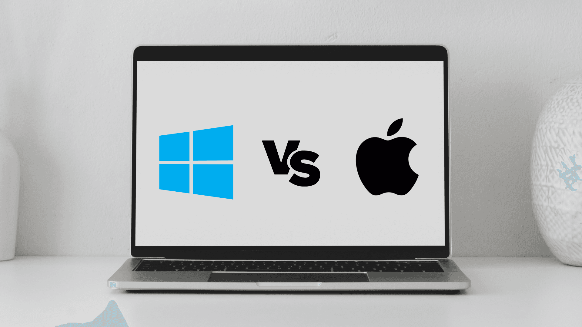 Computer with the Windows and Mac icon with a VS icon in between them, representing the task manager shortcut for different operating systems