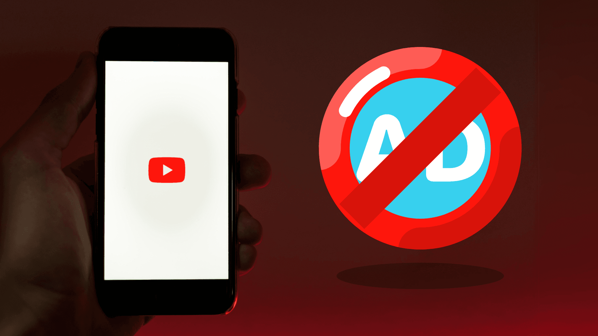Hand holding a phone with the YouTube logo on it and an adblocker icon on the side, representing adblock not working on YouTube.